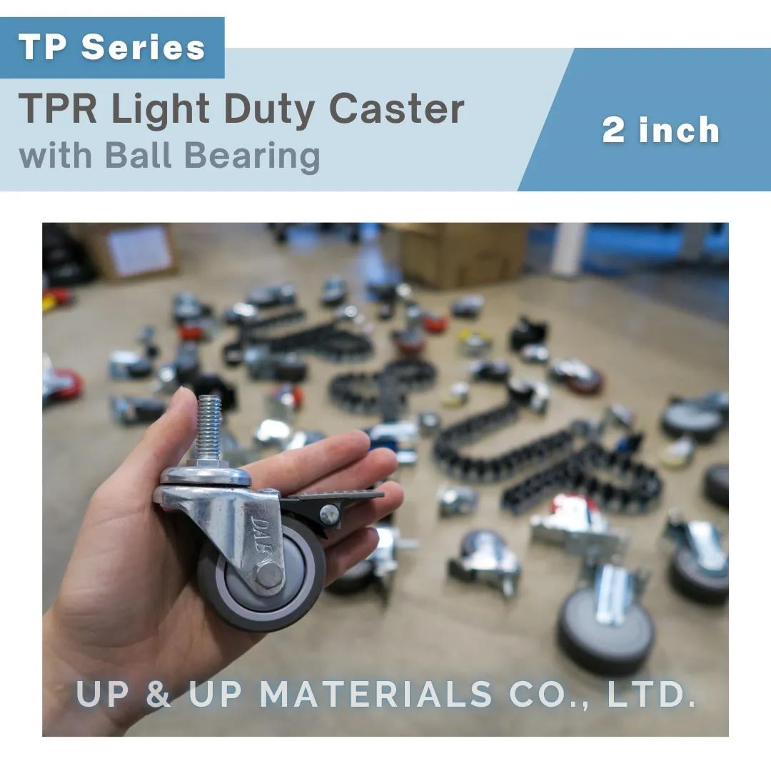 Hand holding 2 inch TPR medical caster with threaded stem and brake, UP&UP Casters